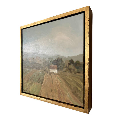Framed painting of a landscape with a road and buildings on a white background